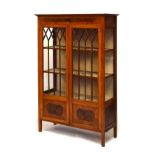Early 20th Century walnut display cabinet fitted three shelves enclosed by a pair of glazed doors,