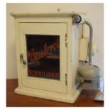 Cream-painted pine medical or bathroom cabinet with glazed door inscribed 'Bacterol Sterilizer',