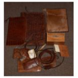 Selection of crocodile skin and other hide folders, belts, purses and other accessories