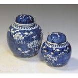 Two Chinese porcelain ginger jars, each with prunus decoration, double ring marks to base, larger