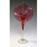 Early 20th Century cranberry glass 'Jack-in-the-pulpit' vase with clear stem and base, 31cm high
