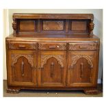 Early 20th Century oak draw-leaf dining table, three dining chairs, and similar sideboard