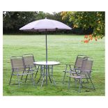 Glass topped circular patio table and four folding chairs and a parasol