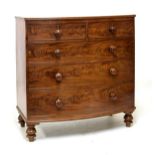 19th Century mahogany bow front chest of two short over three long drawers on turned feet, 105cm