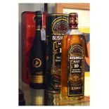 One bottle Bushmills Single Malt Irish Whiskey, together with one bottle Remy Martin VSOP Cognac (2)