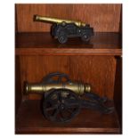 Two old reproduction cast metal model cannon, the larger 33cm long (2)