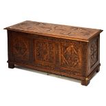 20th Century oak carved triple panel front coffer having hinged cover, 100cm wide