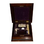 19th Century rosewood games box having hinged cover with partitioned interior and a number of