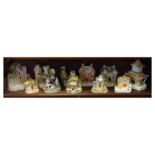 Collection of mainly 19th Century Staffordshire pottery cottages, pastille burners, moneybox etc