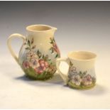 Moorcroft pottery Dog Rose pattern jug and mug, each of bulbous form, the larger 14cm high