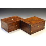 Two Victorian figured walnut writing slopes having hinged covers, one fitted brass mounts and