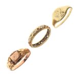 Three assorted 9ct gold and yellow metal rings comprising, two signet rings and a full eternity