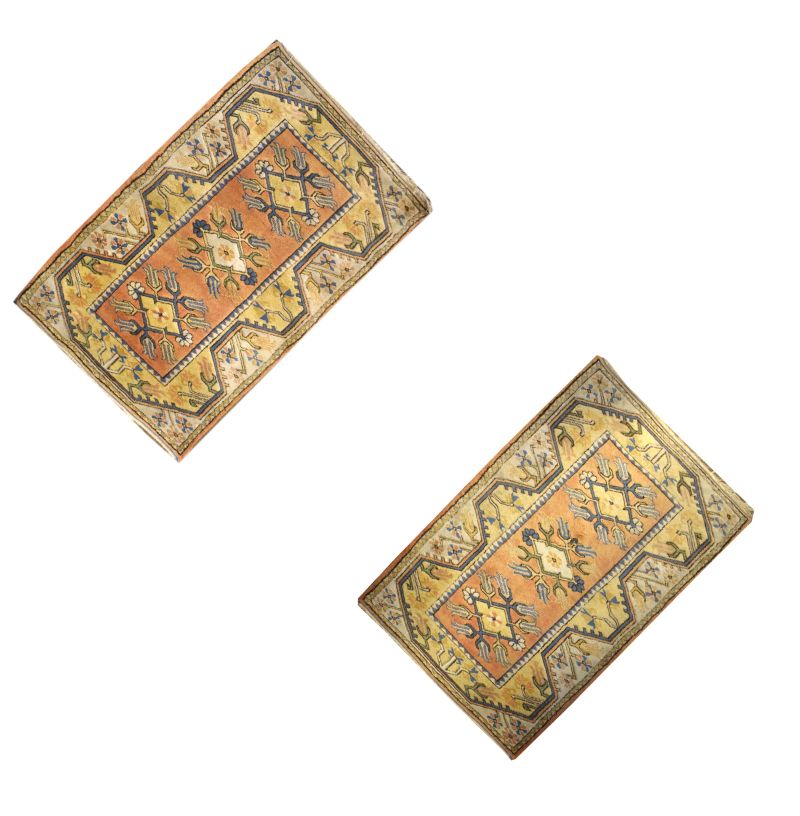 Pair of Middle Eastern-style wool rugs, each with terracotta field and three lozenges within arcaded