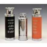 Three various novelty 'Thirst Extinguisher' cocktail shakers, each with musical mechanism, two