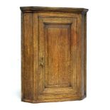 19th Century oak wall hanging corner cupboard fitted one door
