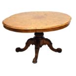 Victorian shaped oval figured walnut loo table raised on bulbous turned carved support terminating