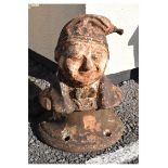 Unusual late 19th Century cast iron figural capstan modelled as a gentleman in bow-tie, jacket and