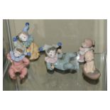 Five various Spanish Nao porcelain figurines modelled as clown children (3) and babies (2),