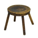 Rustic four legged milking stool, 24.5cm diameter