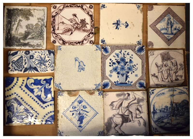 Group of 18th Century Delftware and other pottery tiles to include; seven manganese examples,