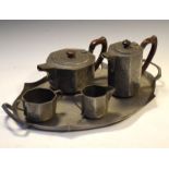 Tudric Pewter four piece tea set having allover hammered style decoration, bases stamped 01650