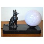 20th Century table lamp formed as a glass globe alongside a seated Alsatian dog on rectangular slate