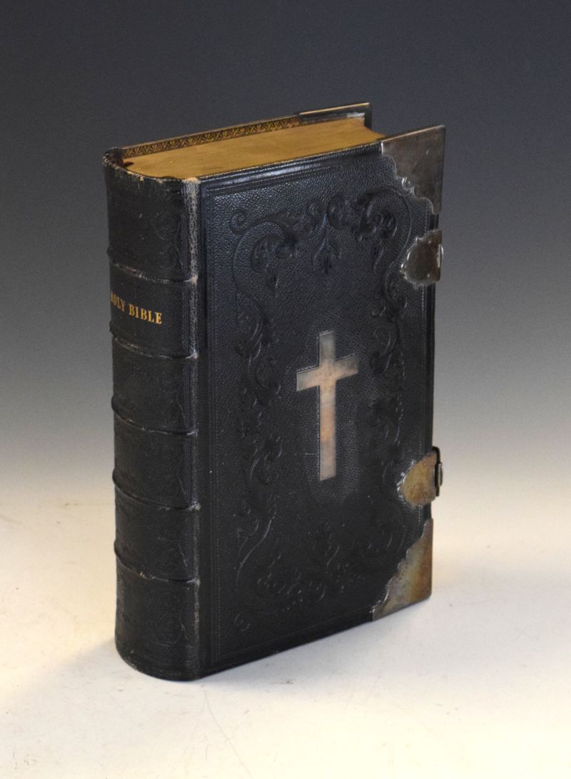 19th Century leather bound Bible having crucifix mount to front