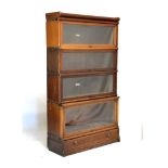 Globe Wernicke mahogany four section bookcase fitted up-and-over doors, 86cm wide