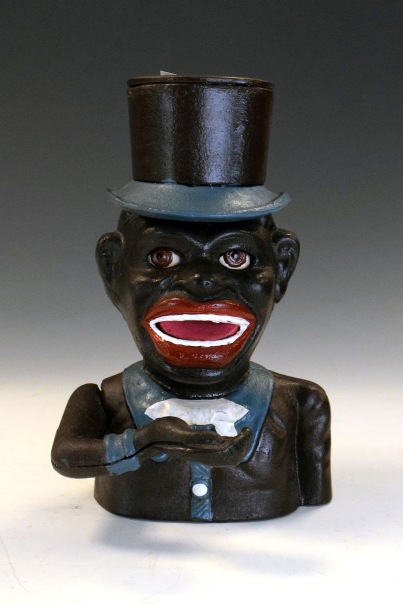 Reproduction American cast iron articulated money bank modelled as 'Jolly Joe' after T.E. Stevens