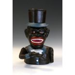 Reproduction American cast iron articulated money bank modelled as 'Jolly Joe' after T.E. Stevens