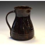 Margaret Leach - Mid 20th Century studio pottery jug of ribbed bulbous form with brown treacle