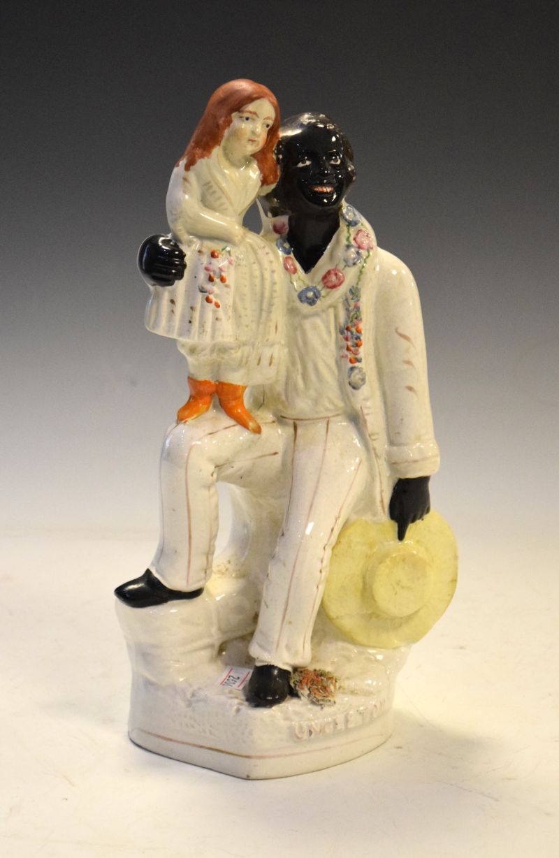 Victorian Staffordshire pottery figure group of Uncle Tom and Eva, 27.5cm high