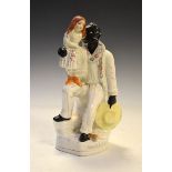 Victorian Staffordshire pottery figure group of Uncle Tom and Eva, 27.5cm high
