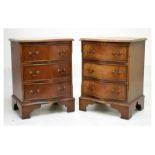 Pair of reproduction mahogany serpentine front bedside chests of three drawers, 45.5cm wide