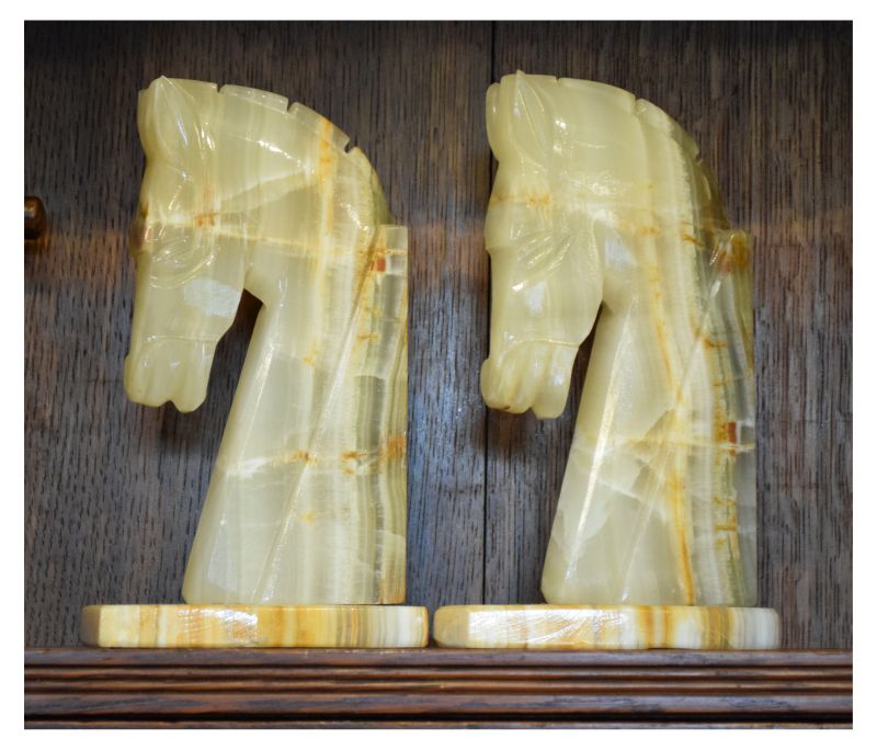 Pair of onyx horse design bookends, 22cm high