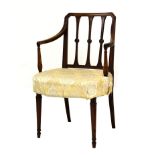 Early 19th Century mahogany elbow chair or carver in the Sheraton taste, with three disc-centred