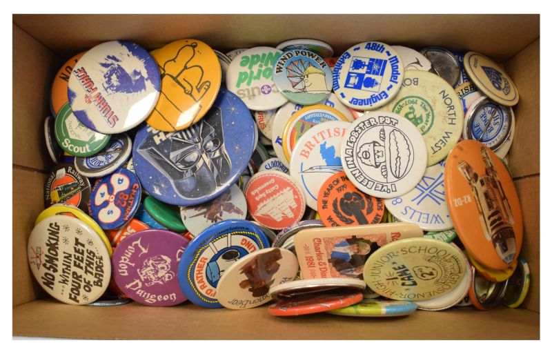 Collection of largely vintage advertising pin badges to include; Exeter Maritime museum, Clarks,