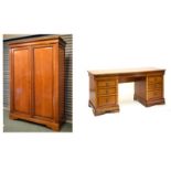 Reproduction walnut finish double wardrobe fitted two doors opening to reveal a mirror to the
