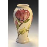 Walter Moorcroft pottery Magnolia pattern vase of baluster form, 30.5cm high