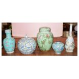 Five Oriental ceramic jars and covers, vases, ranging from 12.5cm high to 29cm high