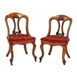 Pair of Victorian oak carved dining chairs having acanthus carved back, upholstered button seat