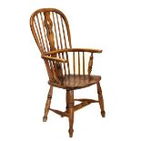 19th Century ash and elm high hoop-back Windsor arm chair with pierced wavy splat over saddle seat