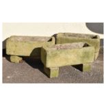 Three reconstituted plant troughs on block supports, 42cm wide x 22cm high