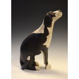 Studio Pottery figure of a black and white dog, impressed mark to base TW, 40cm high