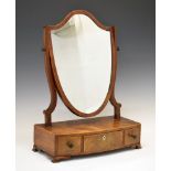 George III mahogany toilet mirror, the shield shaped mirror above a bow front box base fitted