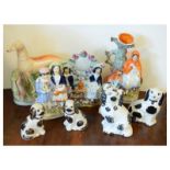 Quantity of Staffordshire pottery figures, spill vase, greyhound etc