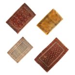 Two Middle Eastern (Belouch or Tekke Turkoman) wool rugs, each having a brick-red field, one