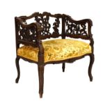 Early 20th Century stained beech heavily carved open arm elbow chair raised on cabriole supports