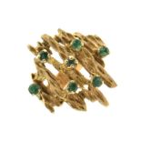 9ct gold dress ring of abstract design set seven green stones, size O, 8.2g gross approx
