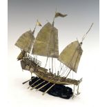 Chinese white metal model of a Chinese gun boat or junk, fitted with three sails, cannons and